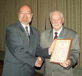 Tim Henderson presenting the Fellow of the C.N.A. Award to George Fraser
